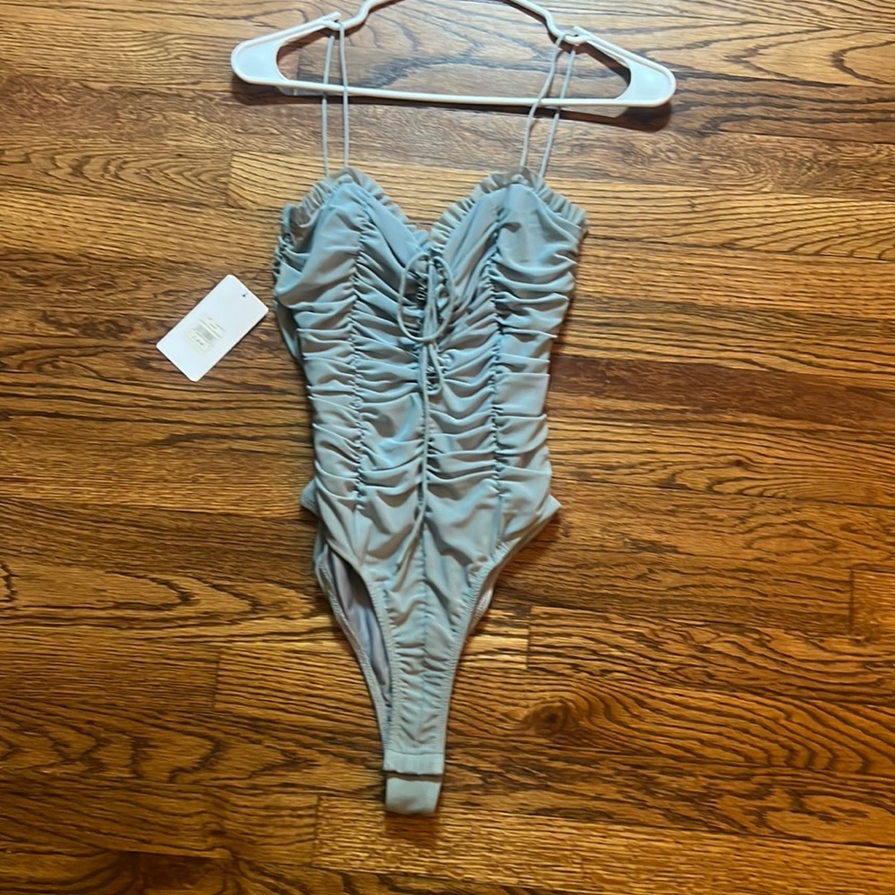 never worn dusty blue bodysuit